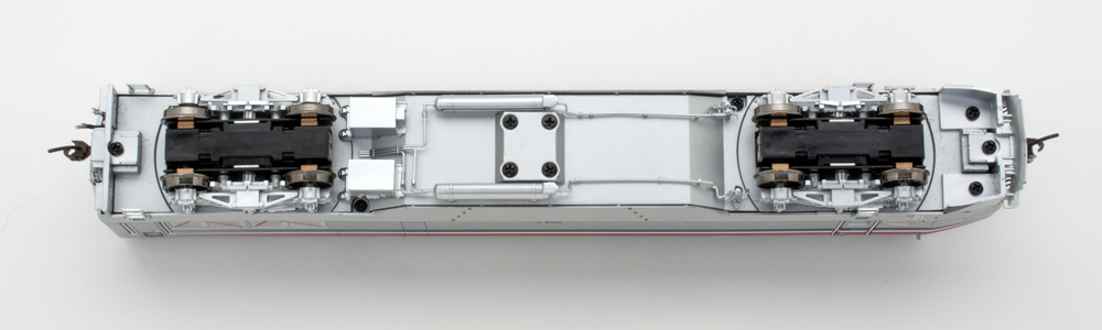 Color photo showing underbody of HO scale diesel locomotive.