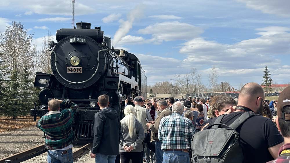 train surrounded by people 