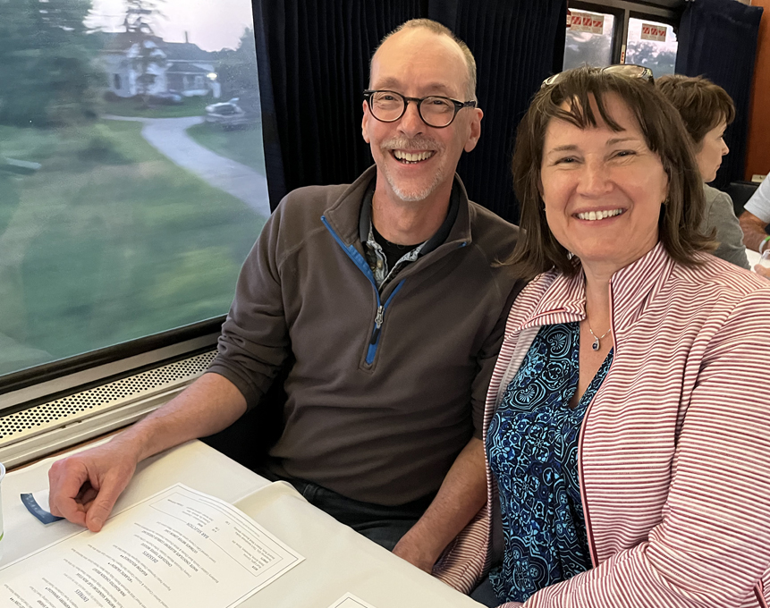 closeup of man and woman on train