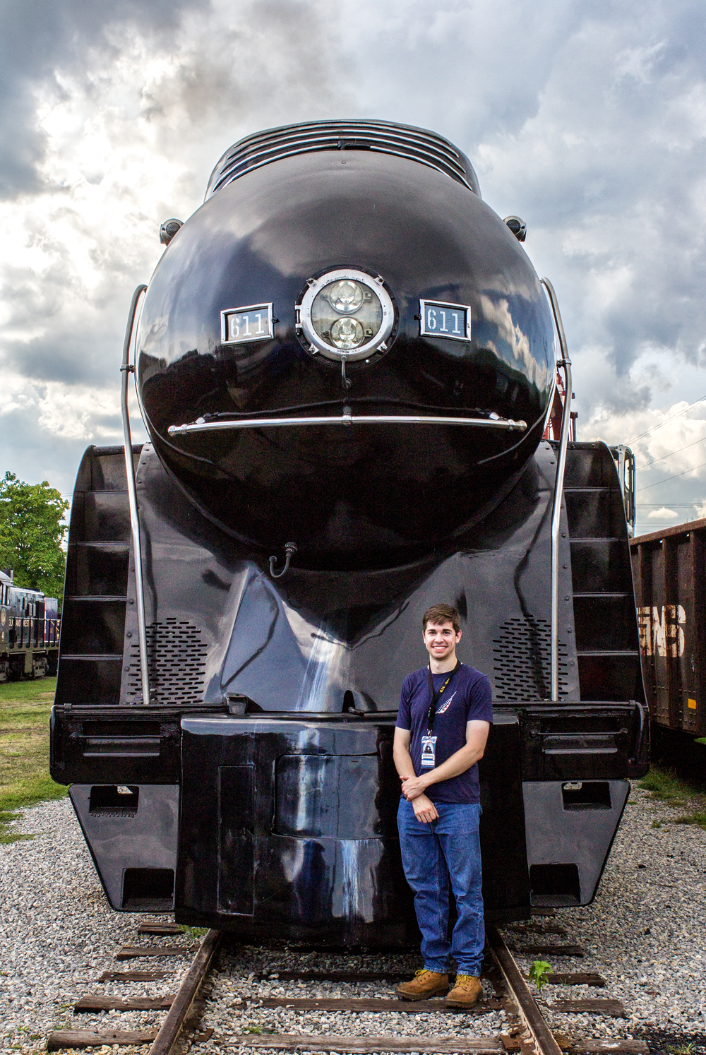 man standing in front of train