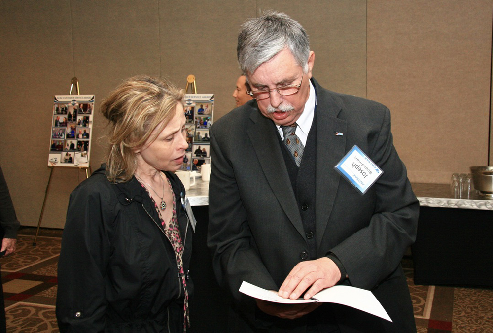 Man and woman looking at papers