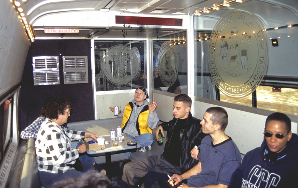 Smokers in separate lounge area in passenger car