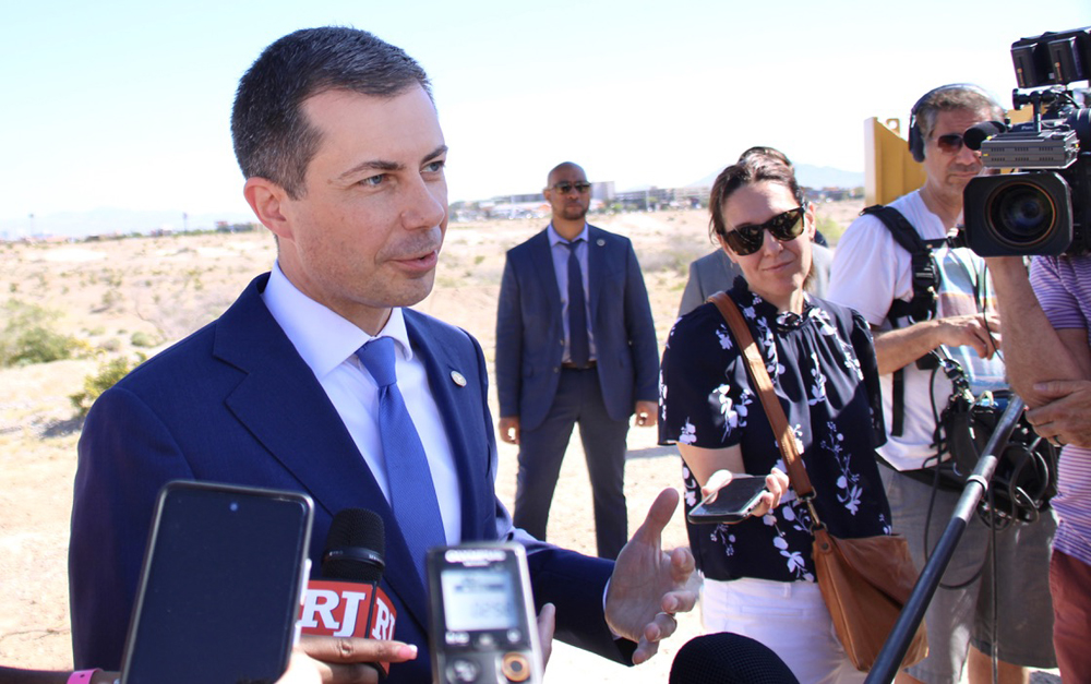 Man surrounded by journalists