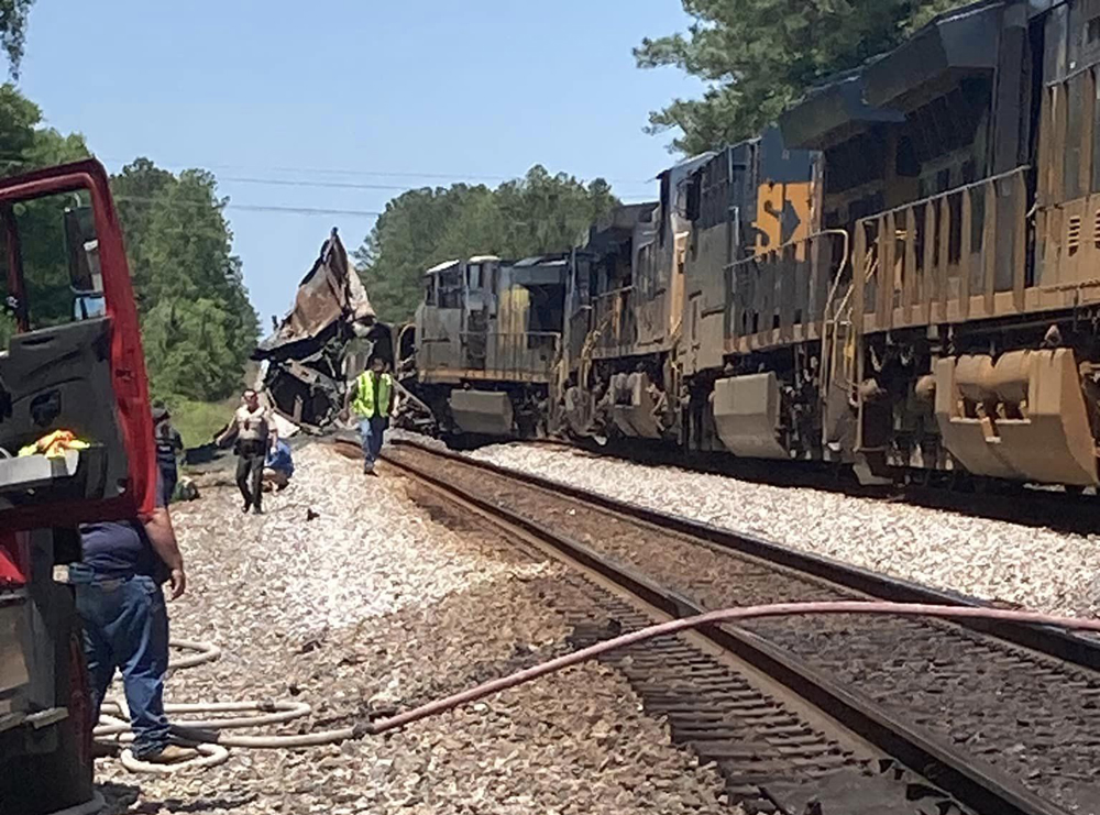 Derailed locomotives at site of collision