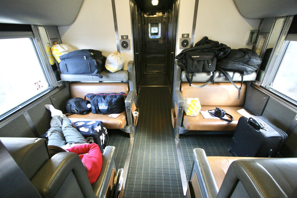 Passengers and luggage on train seats