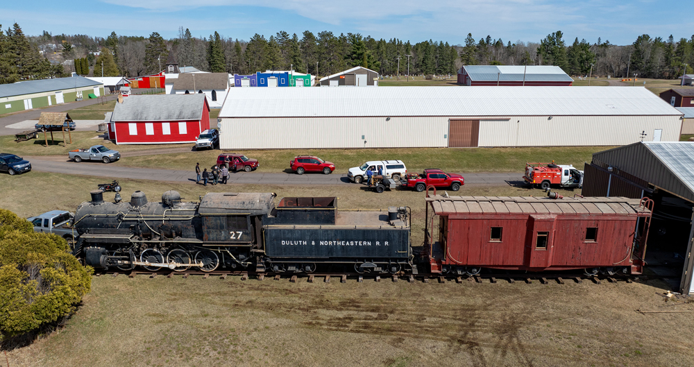 Overhead view of locomotive and caboose on temporary track
