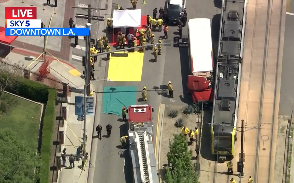 Aerial view of collision between bus and light rail train
