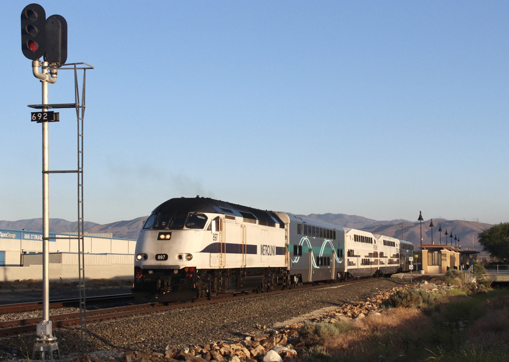 Commuter train approaches signal