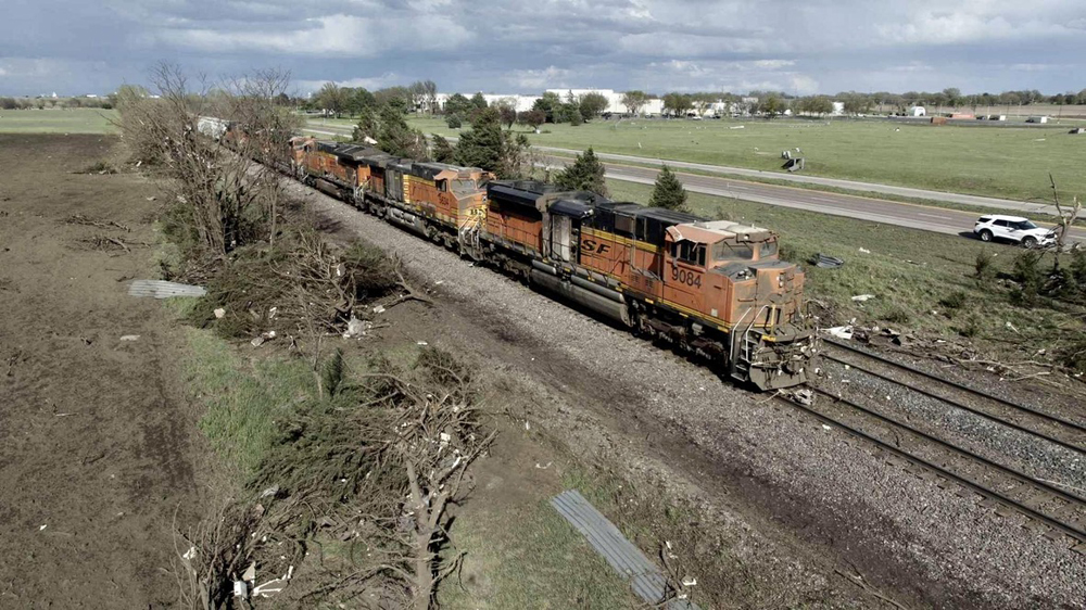 Locomotives showing damage after tornado that derailed freight cars