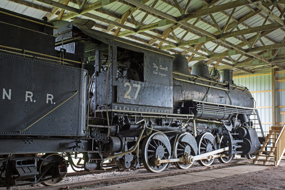A side view of the steam locomotive in the exhibition shed