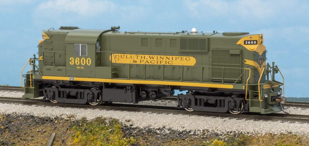 Color photo of green-and-yellow diesel on scenic base.