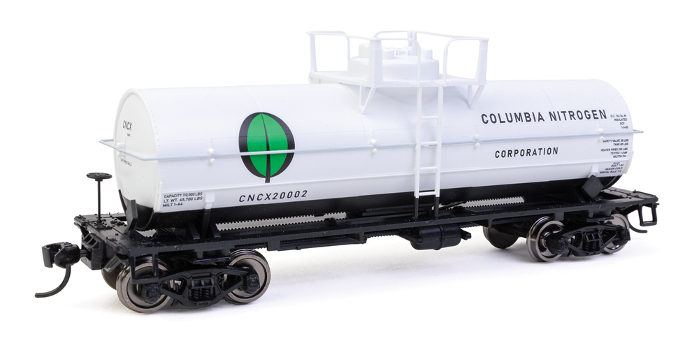 A model tank car in a white paint scheme with a green leaf painted onto the side of the model tank car
