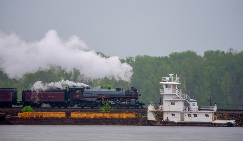 Steam engine and tugboat on Mississippi River