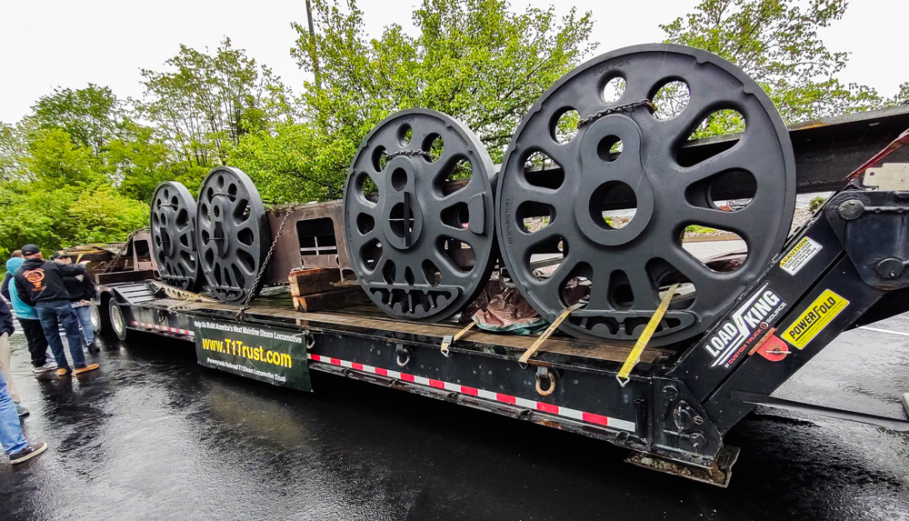 Steam engine wheels and frame on truck trailer