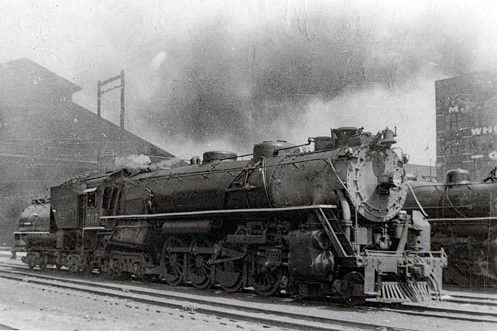 Steam NC&StL locomotives in industrial scene