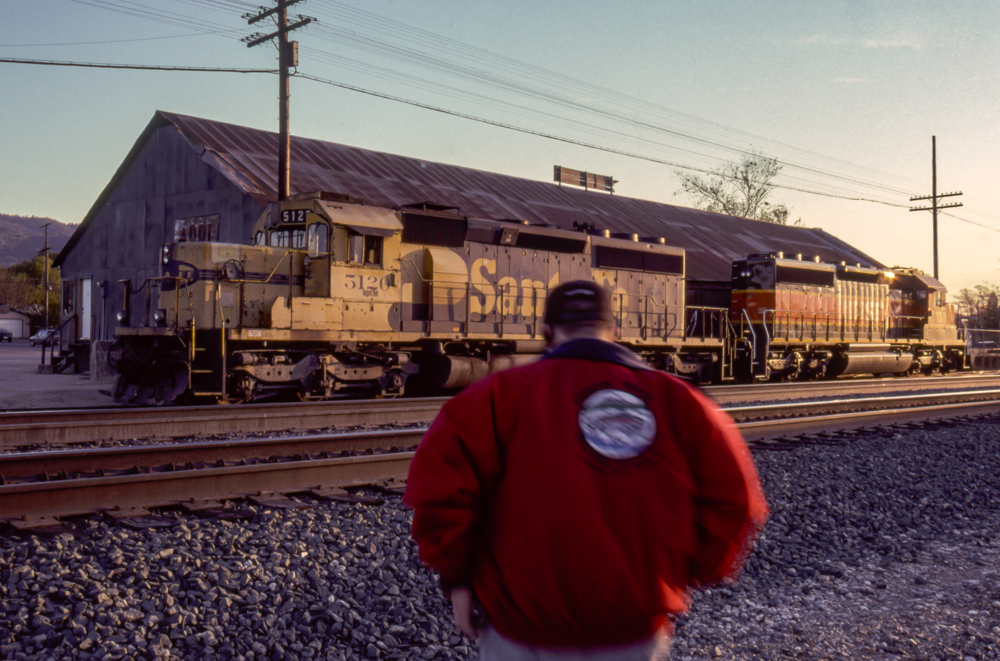 man in front of train