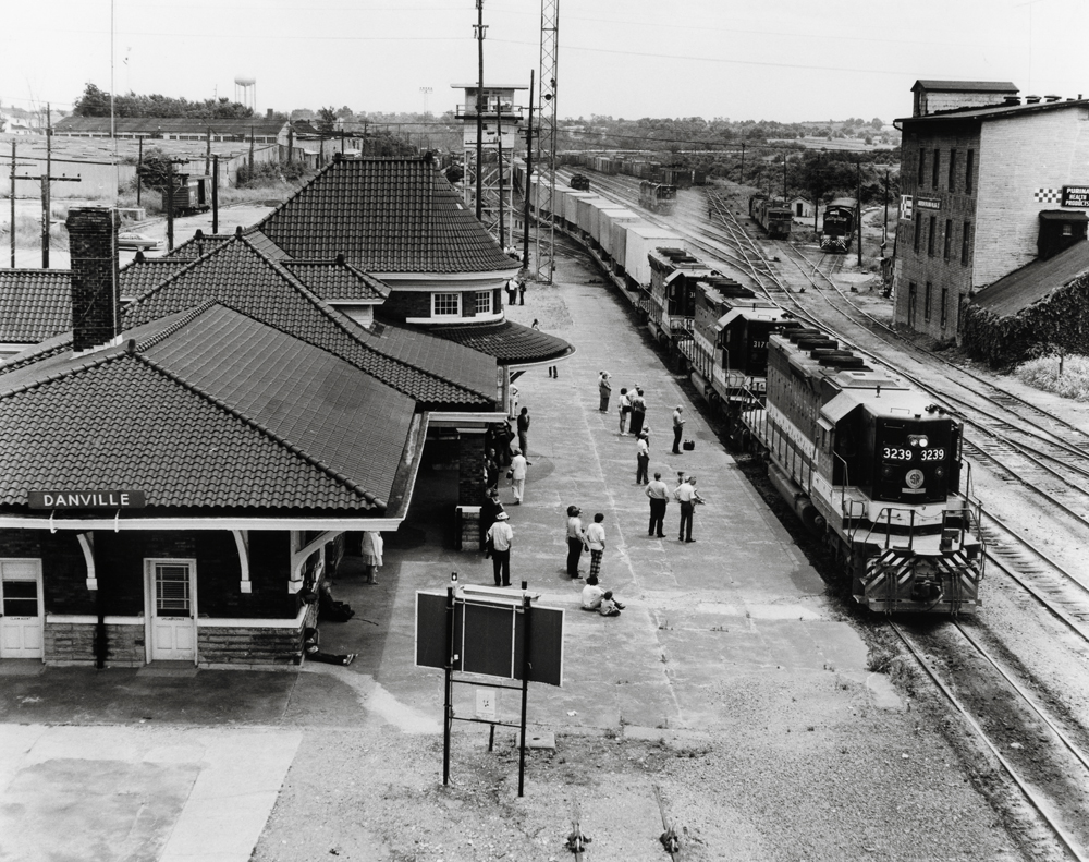 black and white photo of train at train station