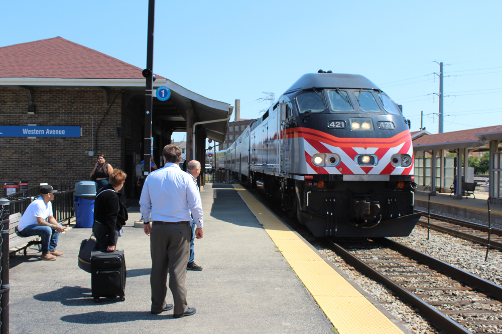 People waiting for Metra train on platform