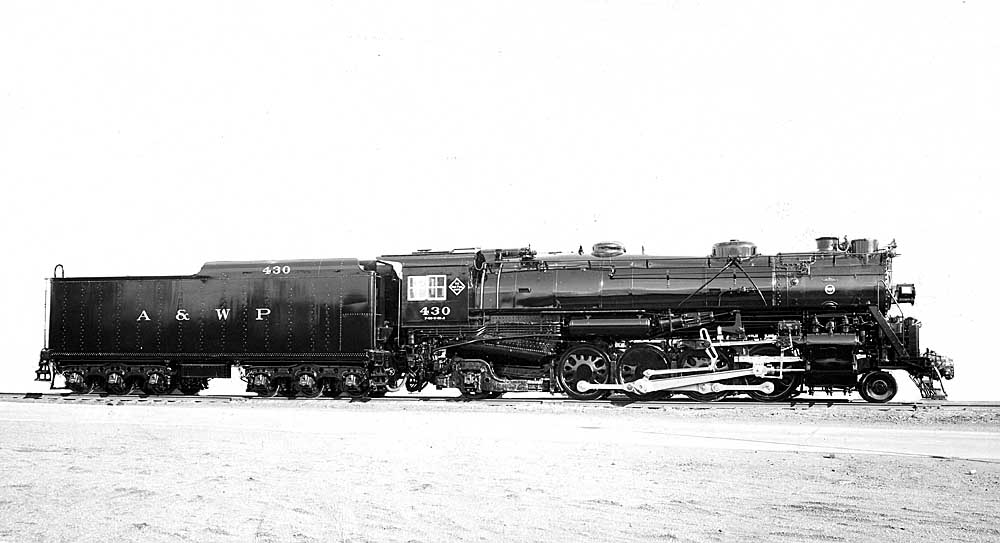 Smoking steam Atlanta & West Point locomotives with freight train