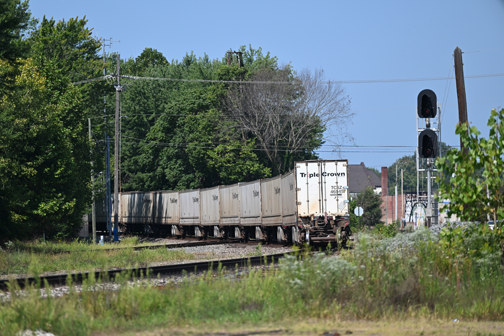 white containers on train