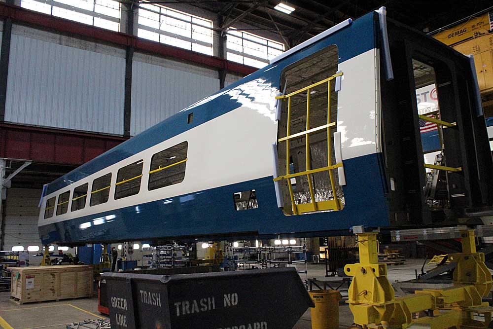 Shell for passenger train car under construction inside factory