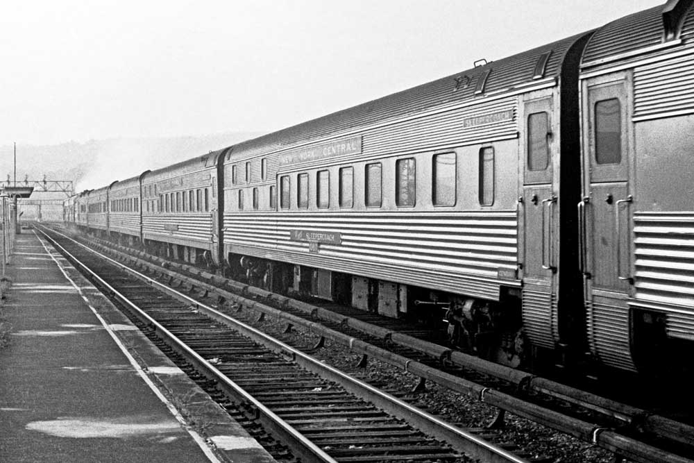 Stainless steel Budd Slumbercoaches at a passenger station