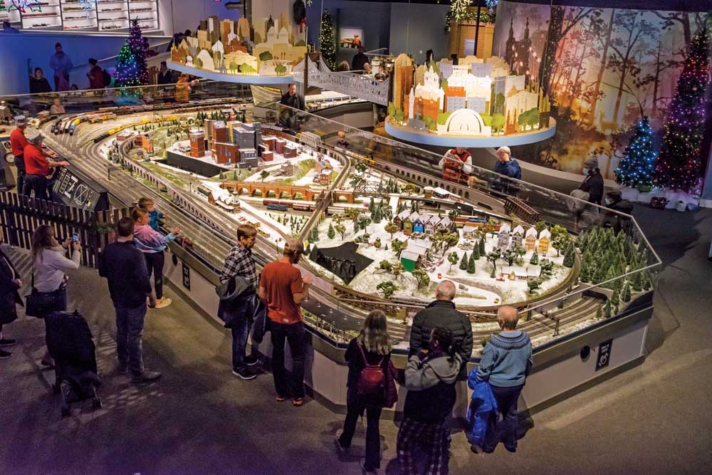 People stand around a Baltimore & Ohio toy train display in Cincinnati
