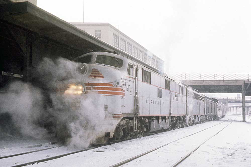 Streamlined Burlington Route diesel locomotives in station with passenger train