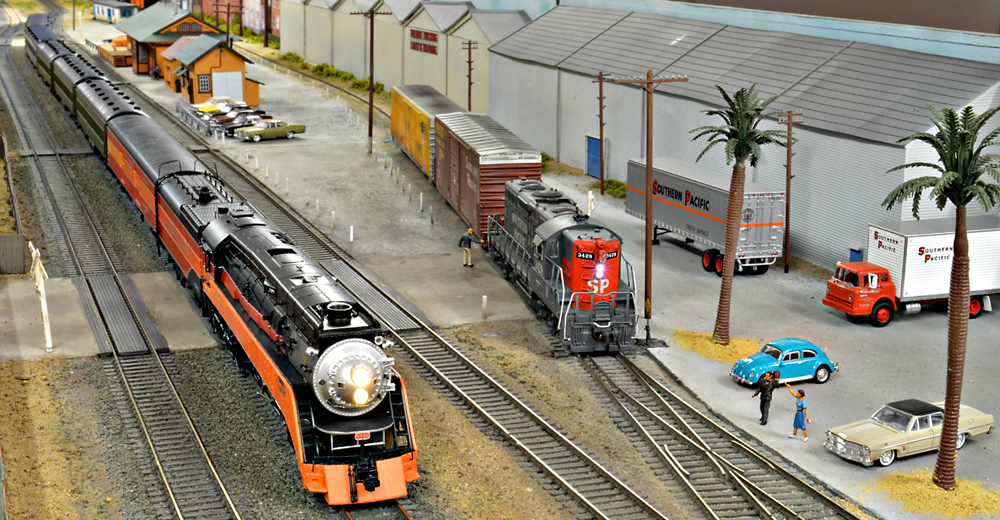 A black model streamline locomotive on a model railroad layout