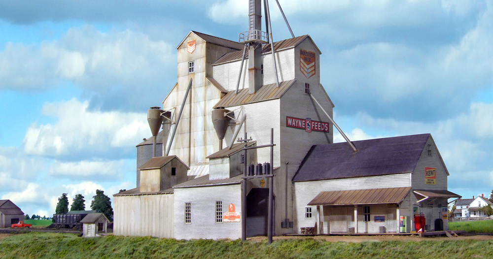 A model grain elevator structure on a model railroad layout