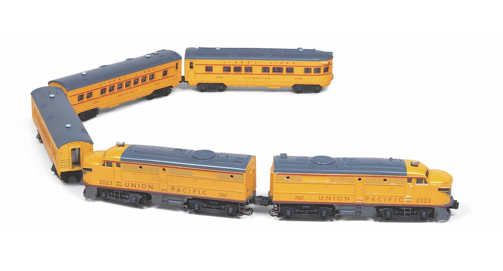Yellow and silver model train in a U shape