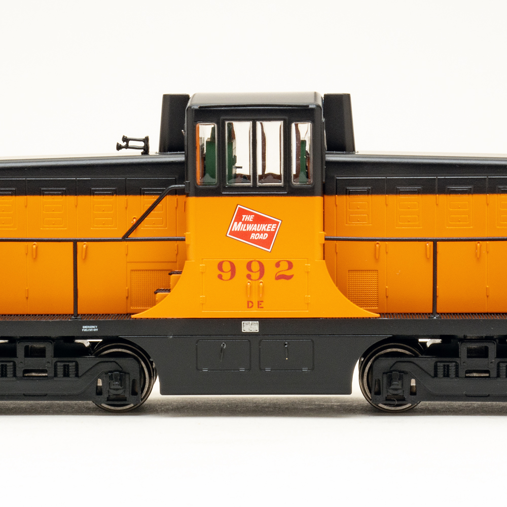 Color photo of orange and black switcher on white background.