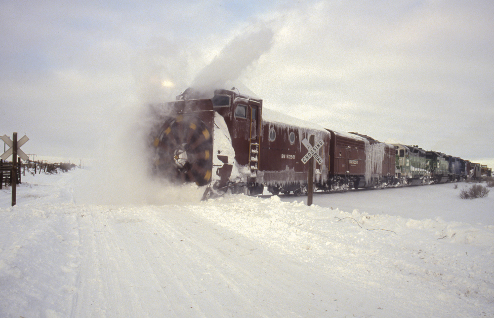 plow on train with snow going everywhere