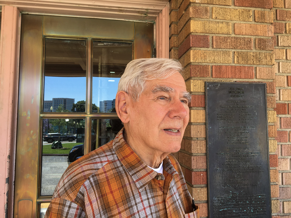 man with plaid shirt and gray hair