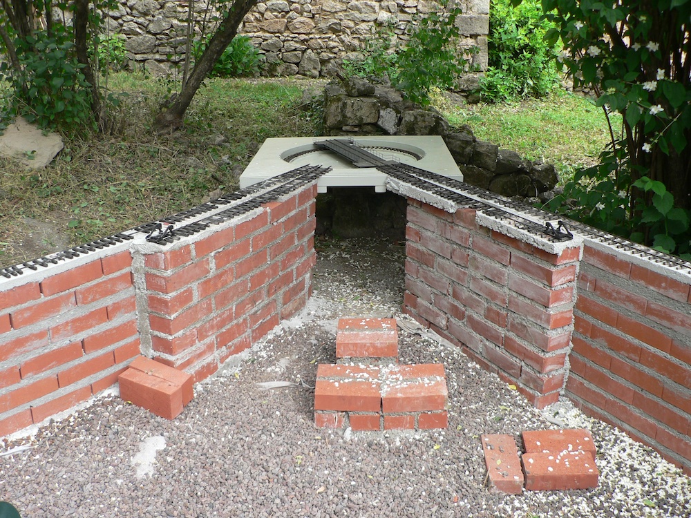 pile of bricks with track and model turntable