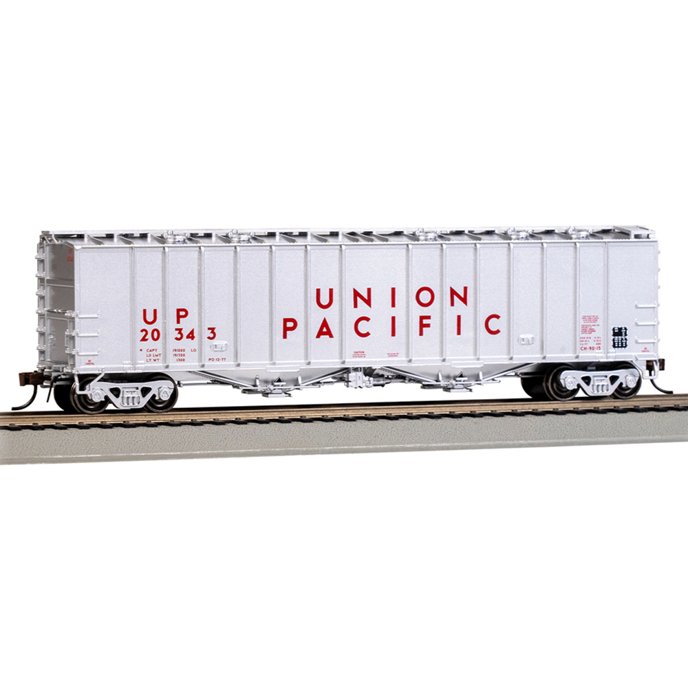A white model freight car on model railroad track with red lettering