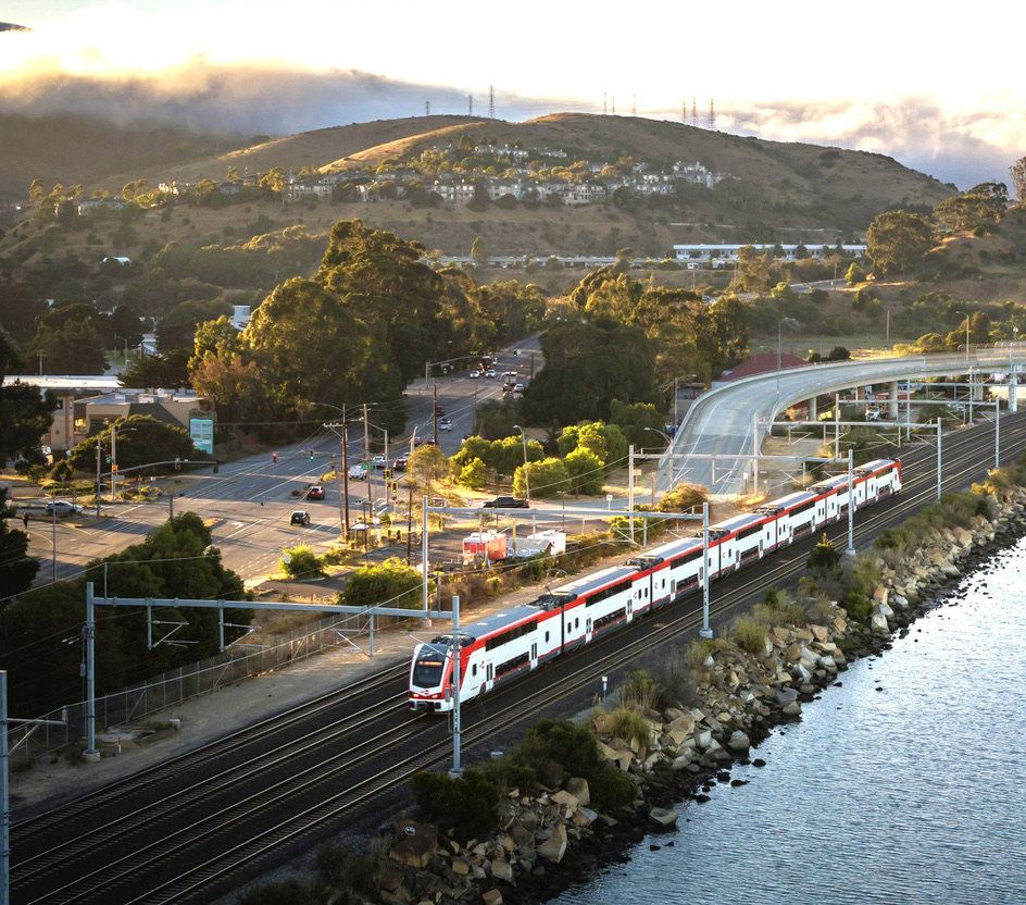 High-angle view of Caltrain commuter train running near water