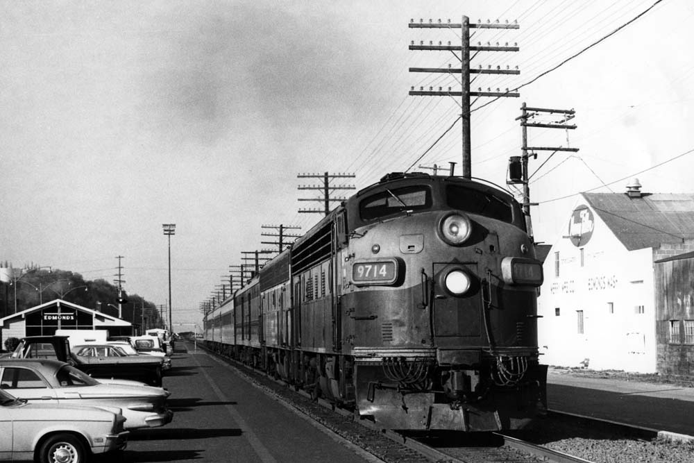Streamlined diesel locomotives with train at station platform