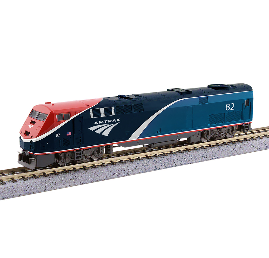 A blue, red and white model locomotive on model rail track
