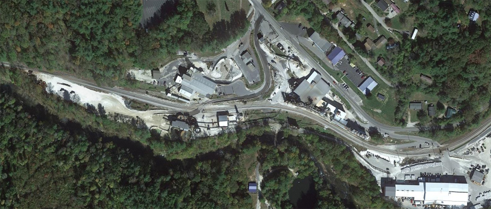 Aerial view of industrial plant along railroad track