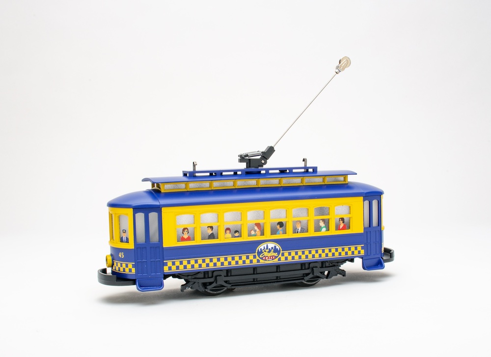 Blue and yellow model trolley; MTH RailKing Skyline Chili Bump-N-Go Trolley