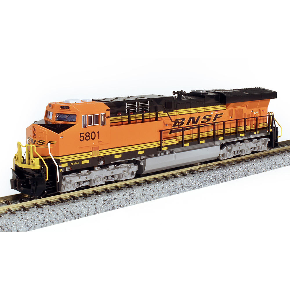 An orange and black model locomotive