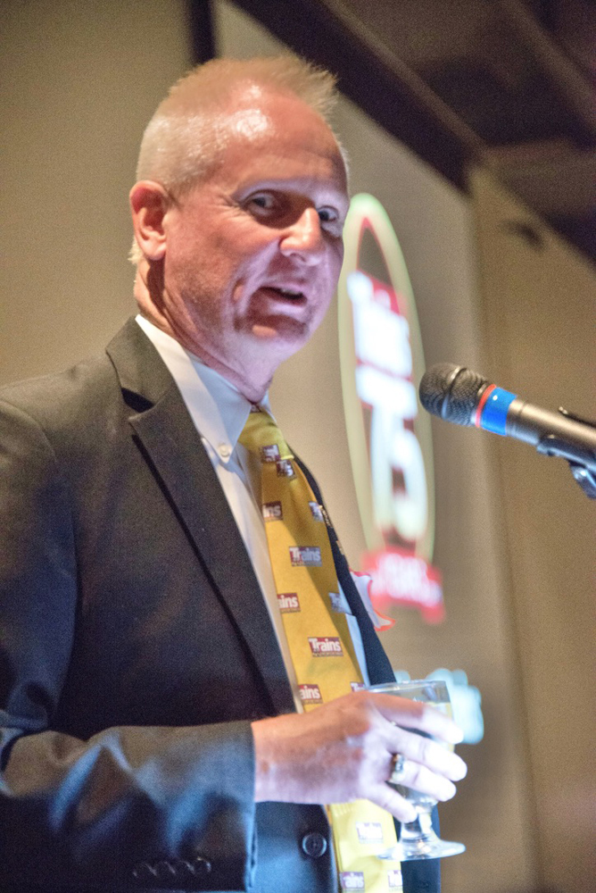 Man in suit in tie at microphone