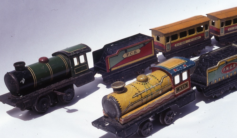 two tinplate toy train sets; Toy trains in Argentina