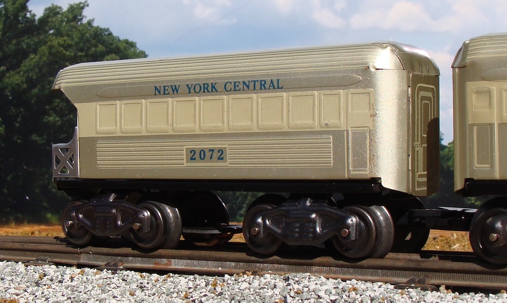 silver model car on track; mystery Marx train set