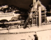 Black and white image on toy train layout with coal tower
