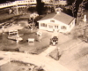 Black and white image on toy train layout with farm
