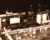 Black and white image on toy train layout with tank car