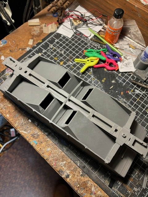 underside of partially assembled model hopper car; 3-D printed fishbelly hopper car