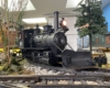 Steam locomotive rounds a curve